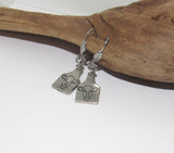 hand stamped cow earrings